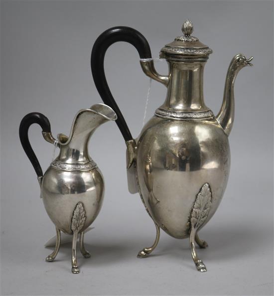 A 19th century Empire style silver coffee pot and cream jug